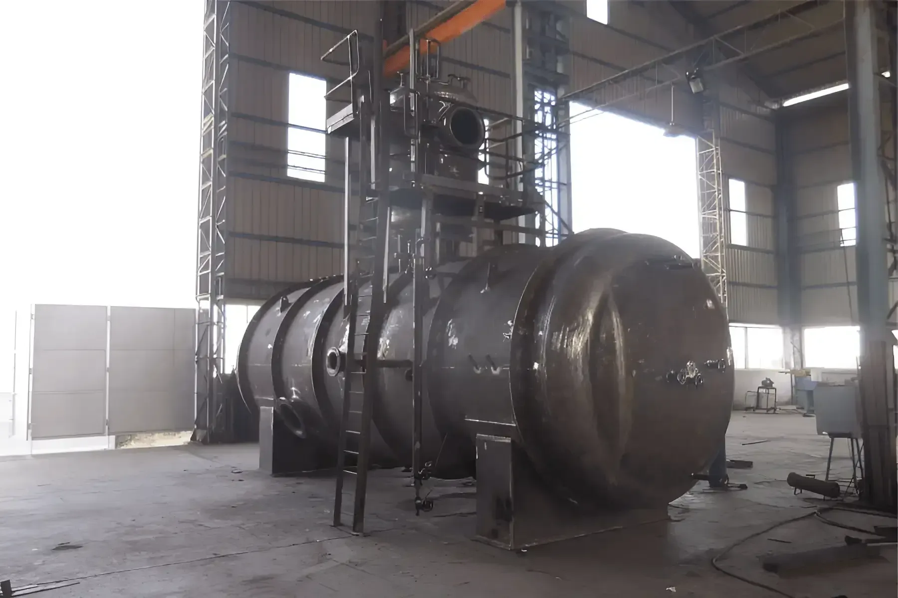 Deaerator with vertical deaerating column mounted on its horizontal storage vessel in the fabrication shop