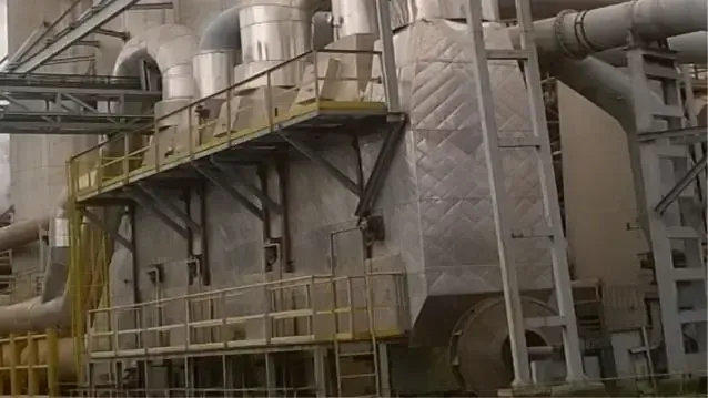 Installed waste heat drying unit with insulated hot gas ducting and access platforms at a steel plant