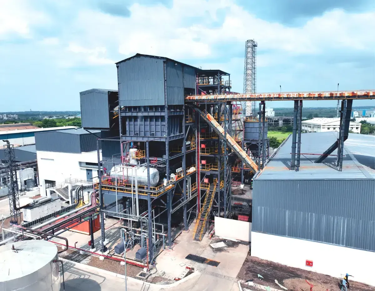 Aerial view of a completed boiler plant with fuel conveyor gallery and dust collector