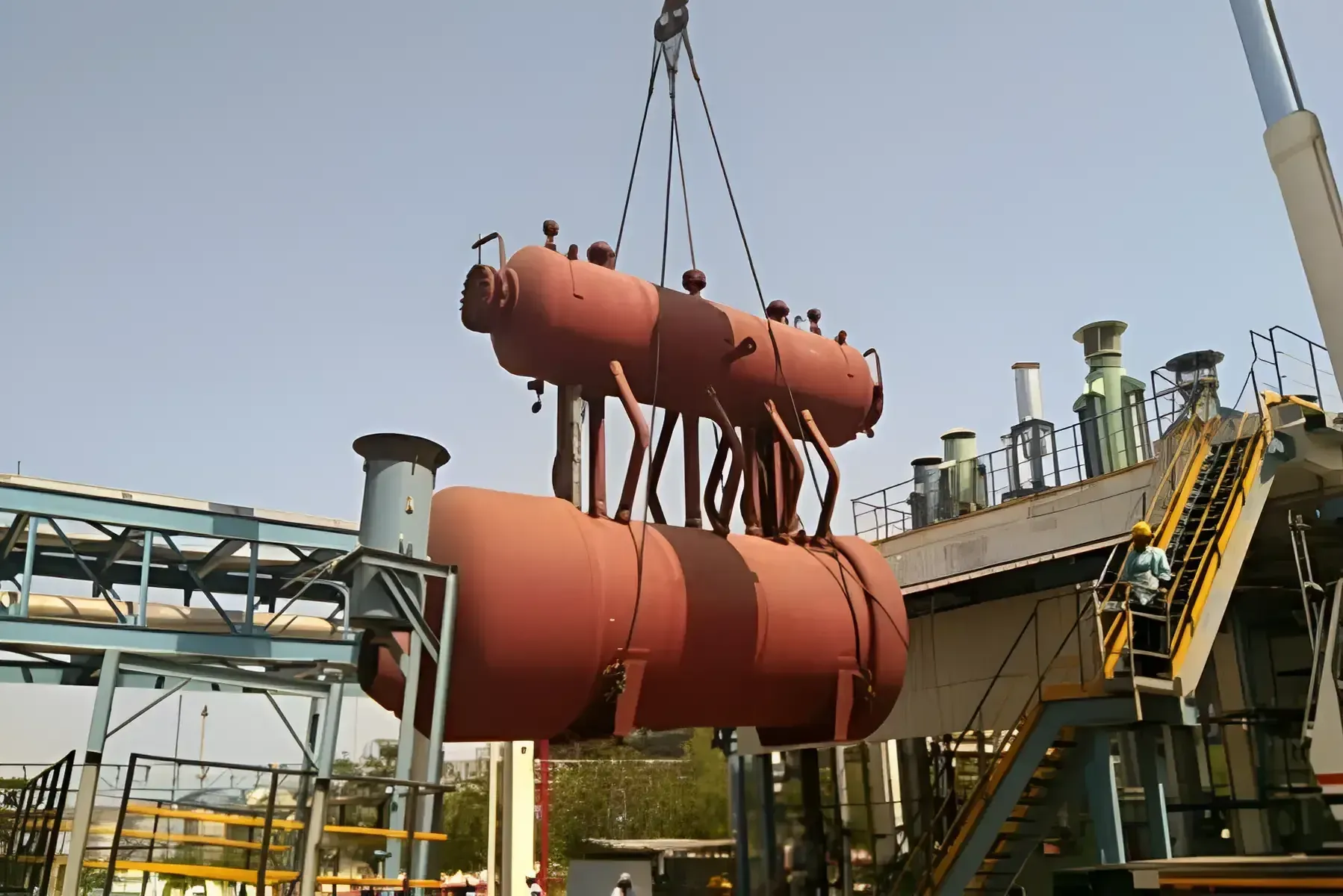 Boiler drums lifted by crane during waste heat recovery boiler erection