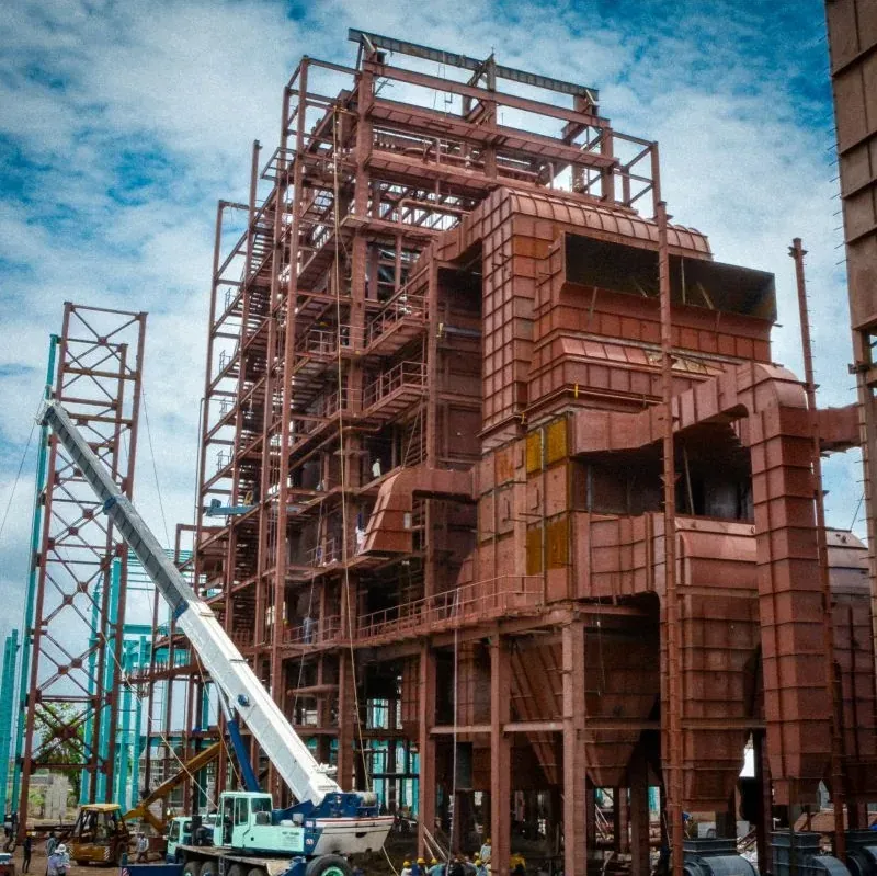 Multi-storey boiler pressure parts under erection at site with a mobile crane alongside